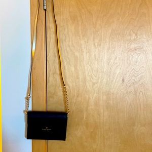 Brand new mini black leather Kate Spade purse. Hold credit cards, ID